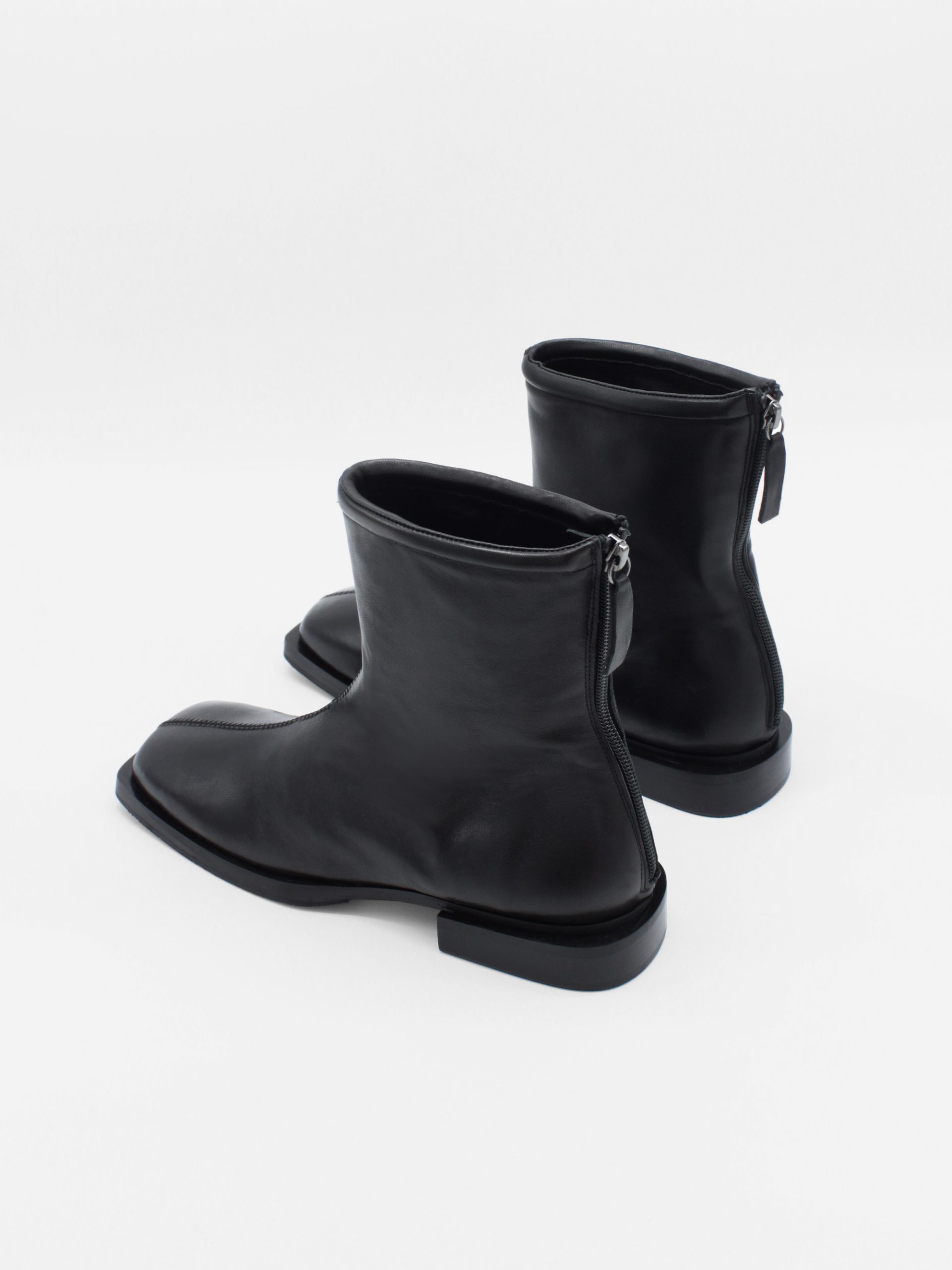 ankle boots in black by about arianne