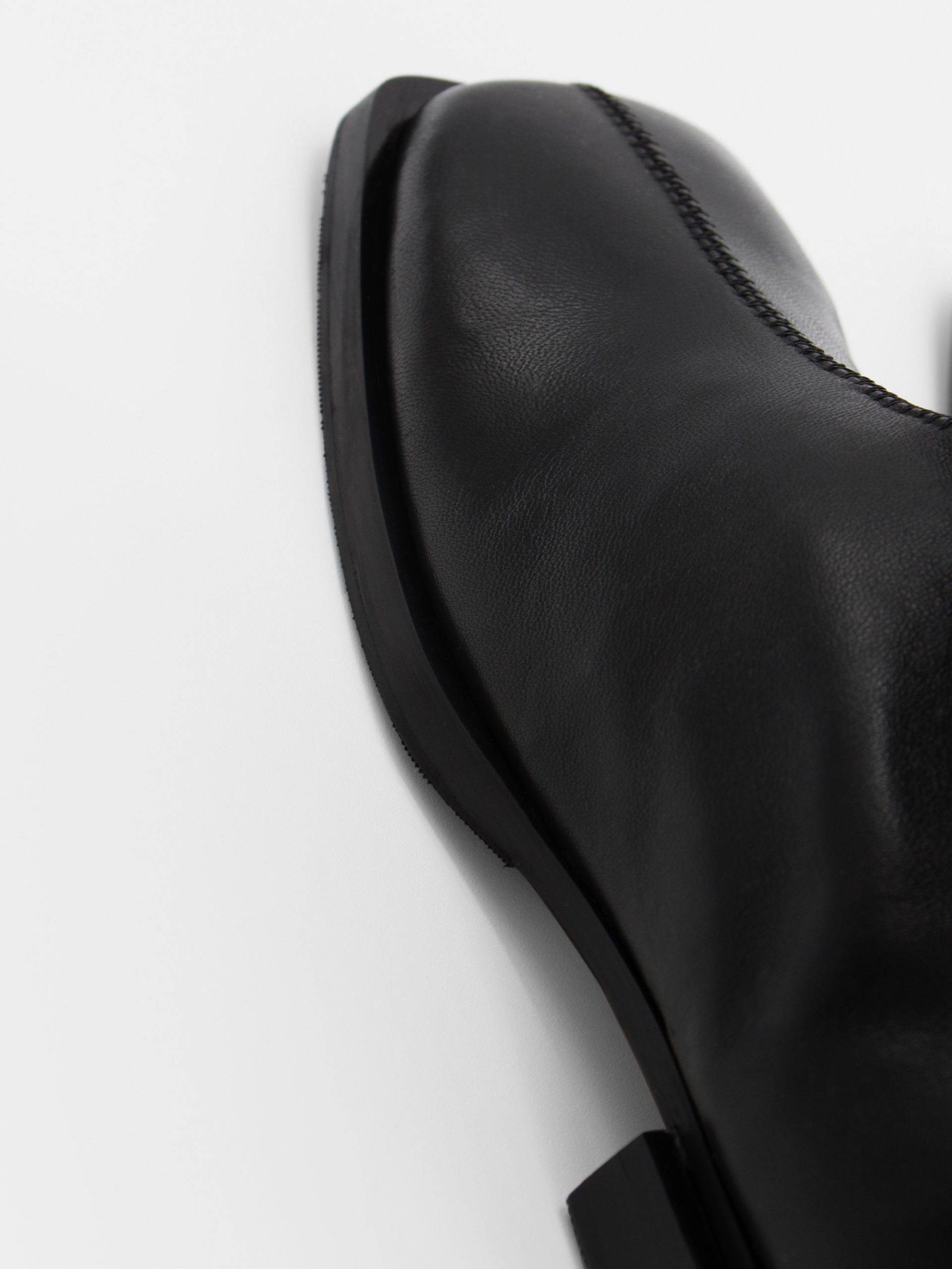 ankle boots in black by about arianne