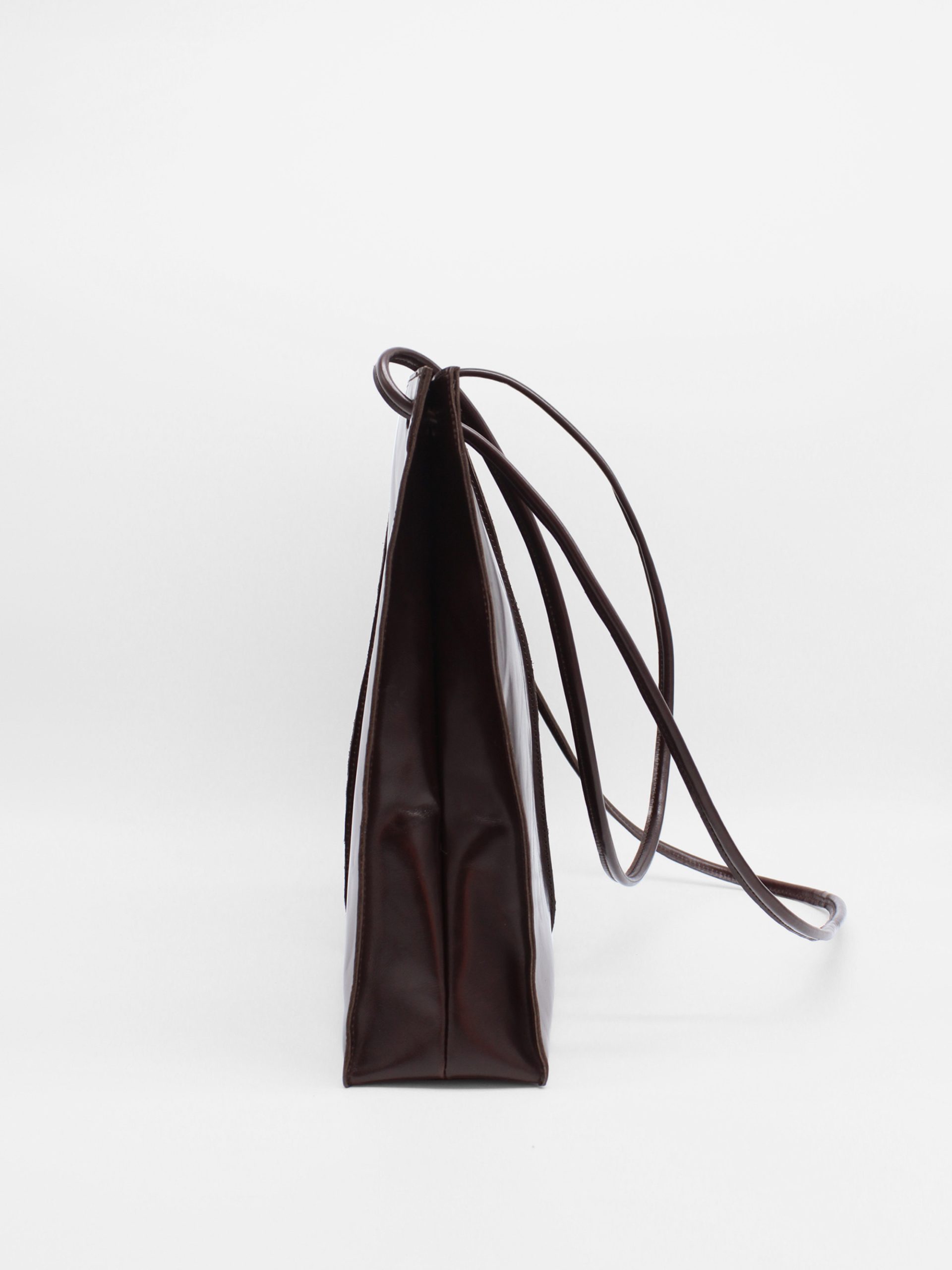 square leather shoulder bag with string straps in brown