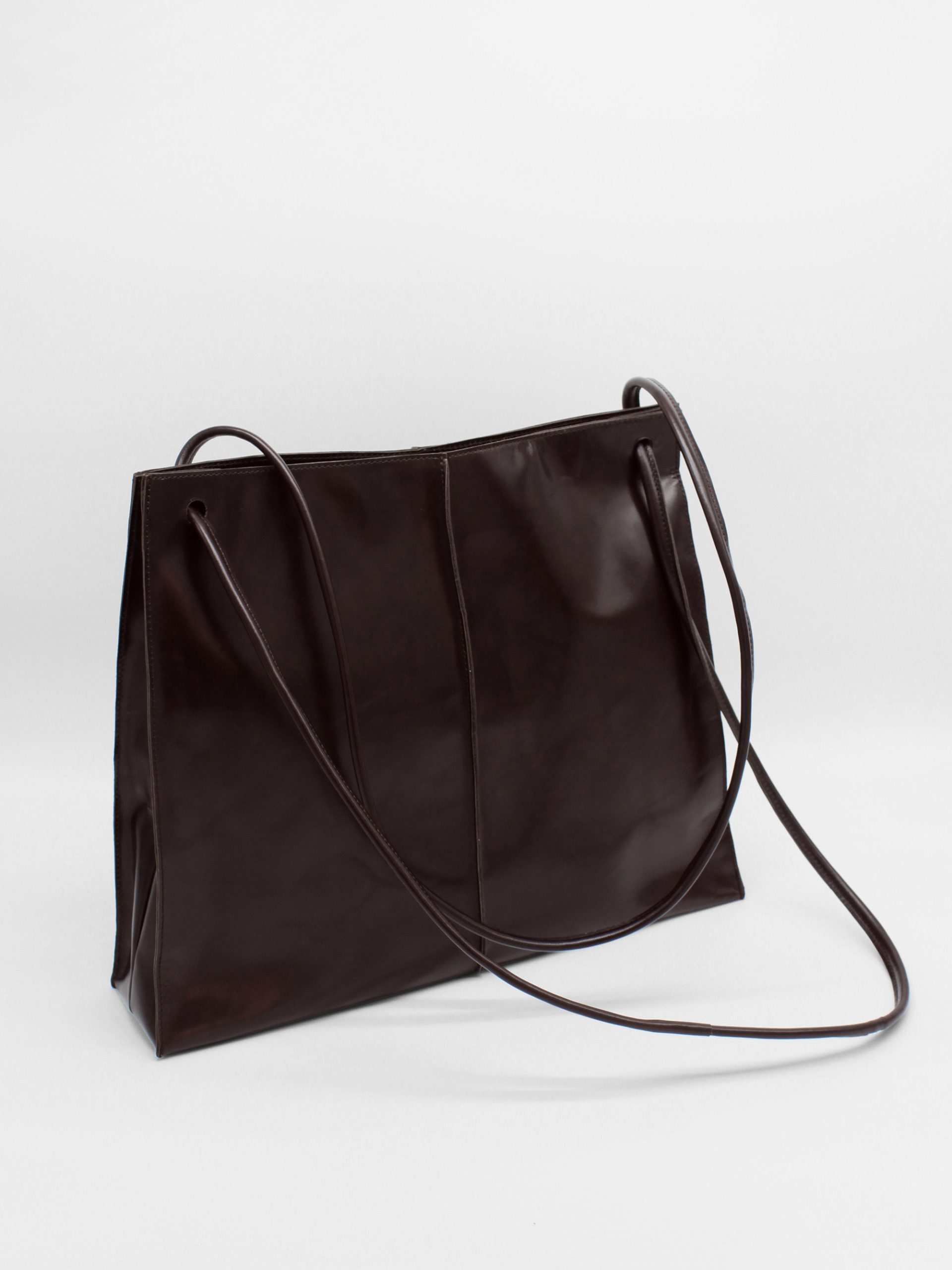 square leather shoulder bag with string straps in brown