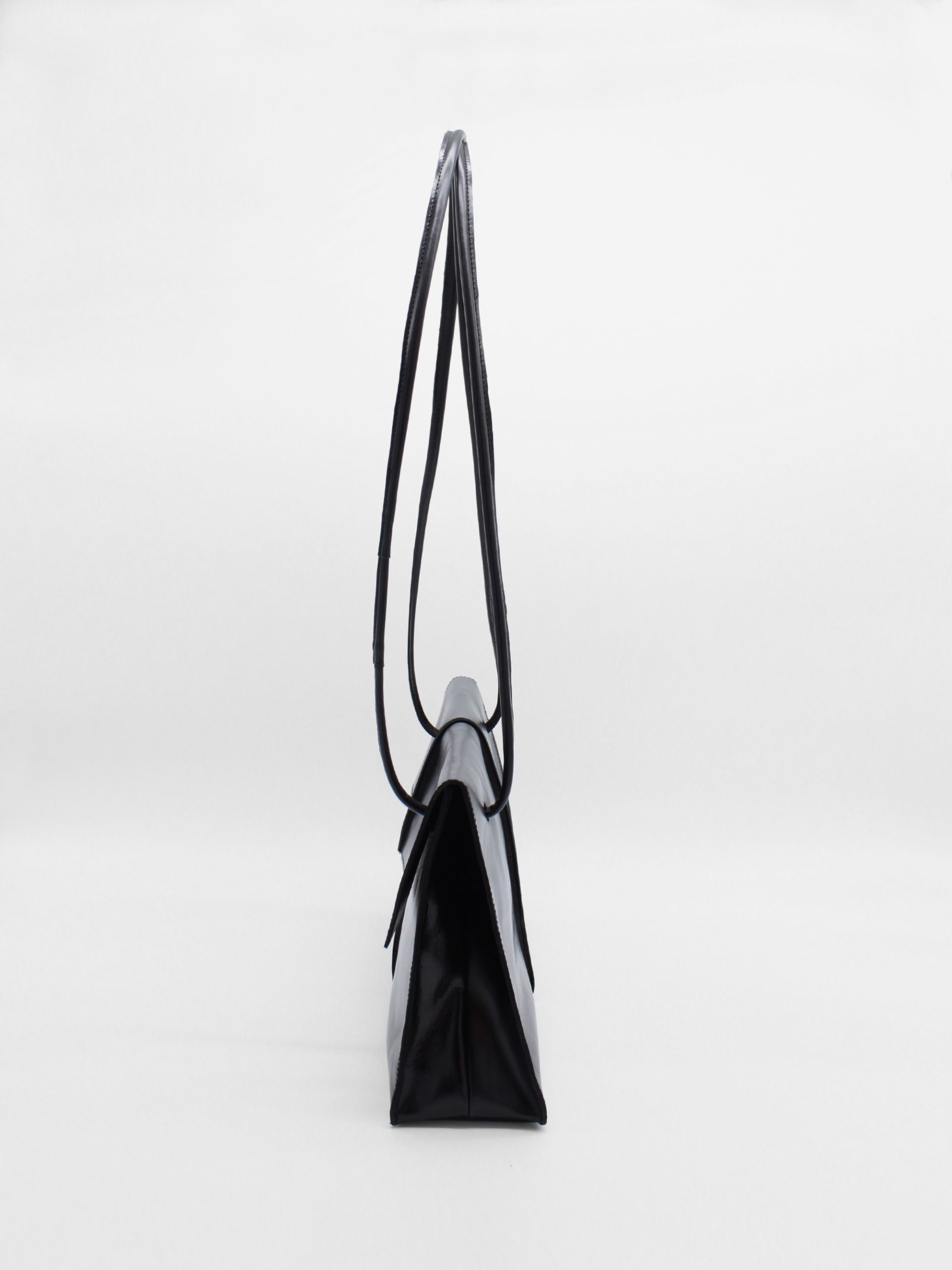 rectangle leather shoulder bag with string straps in black
