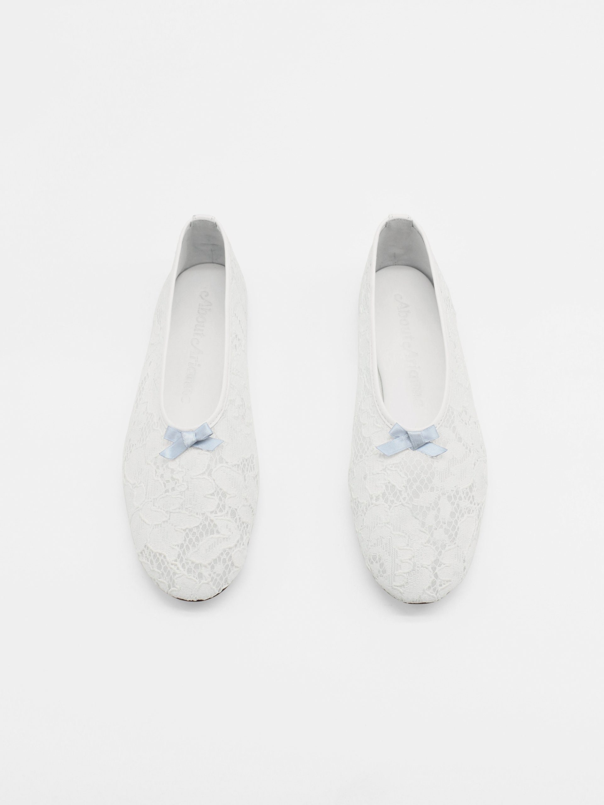 Ballet flats in lace fabric in white