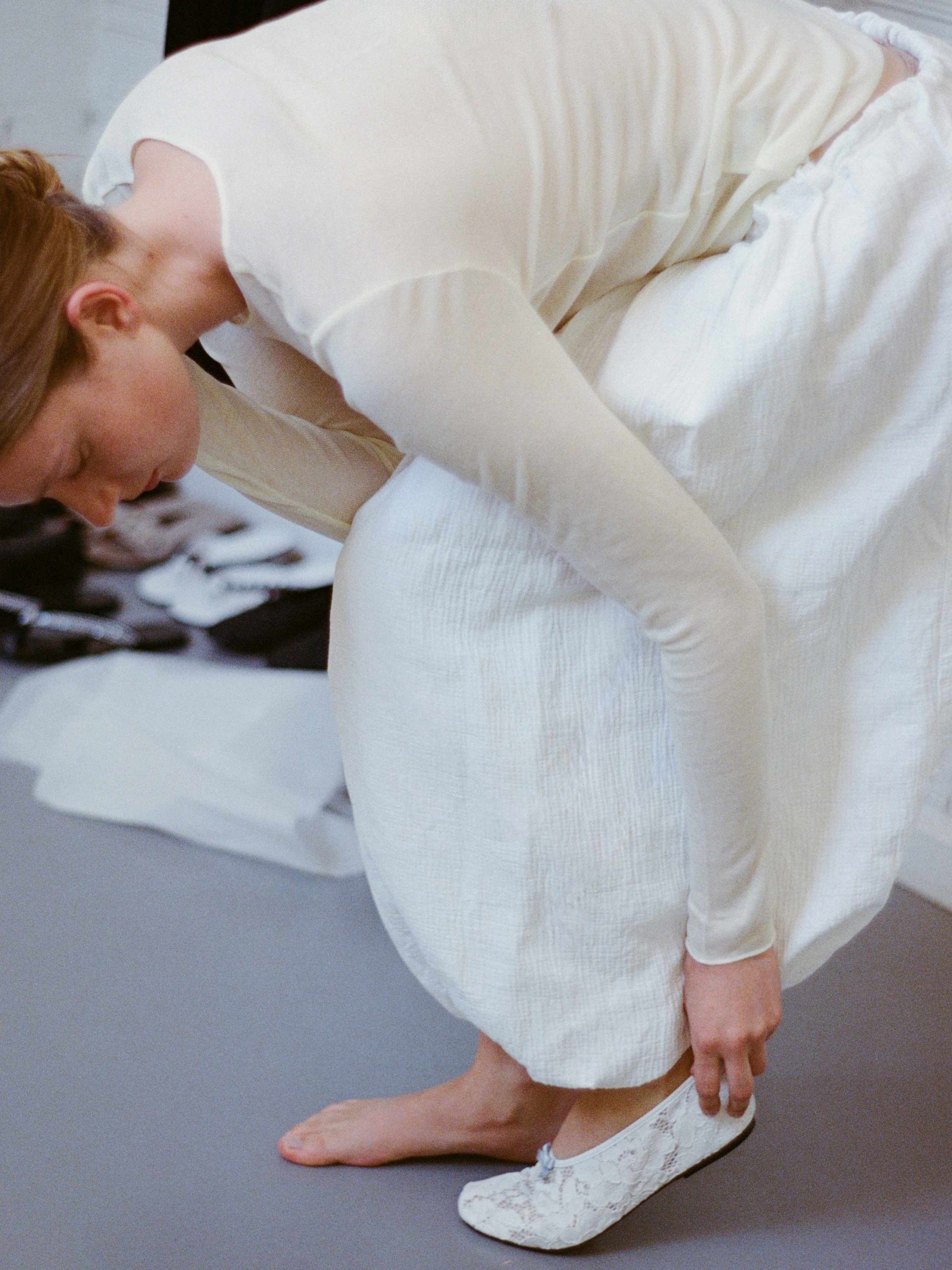 Ballet flats in lace fabric in white