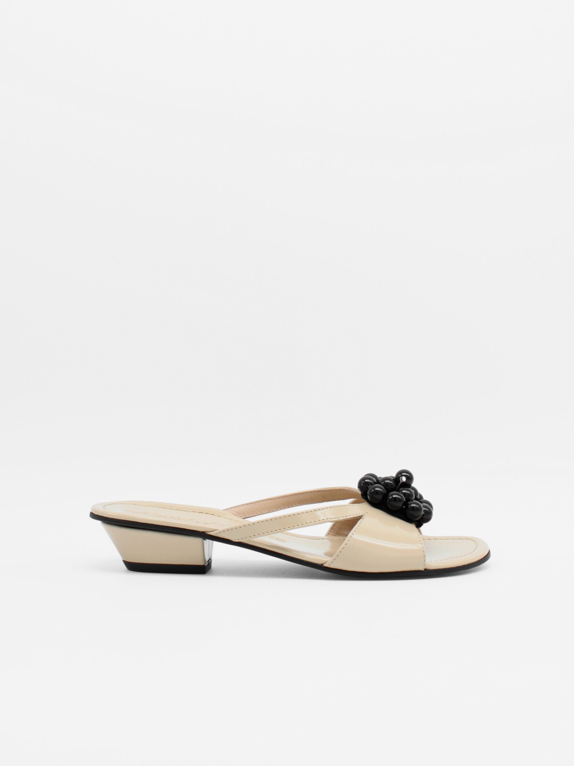 beige kitten heels with beaded ornament by about arianne