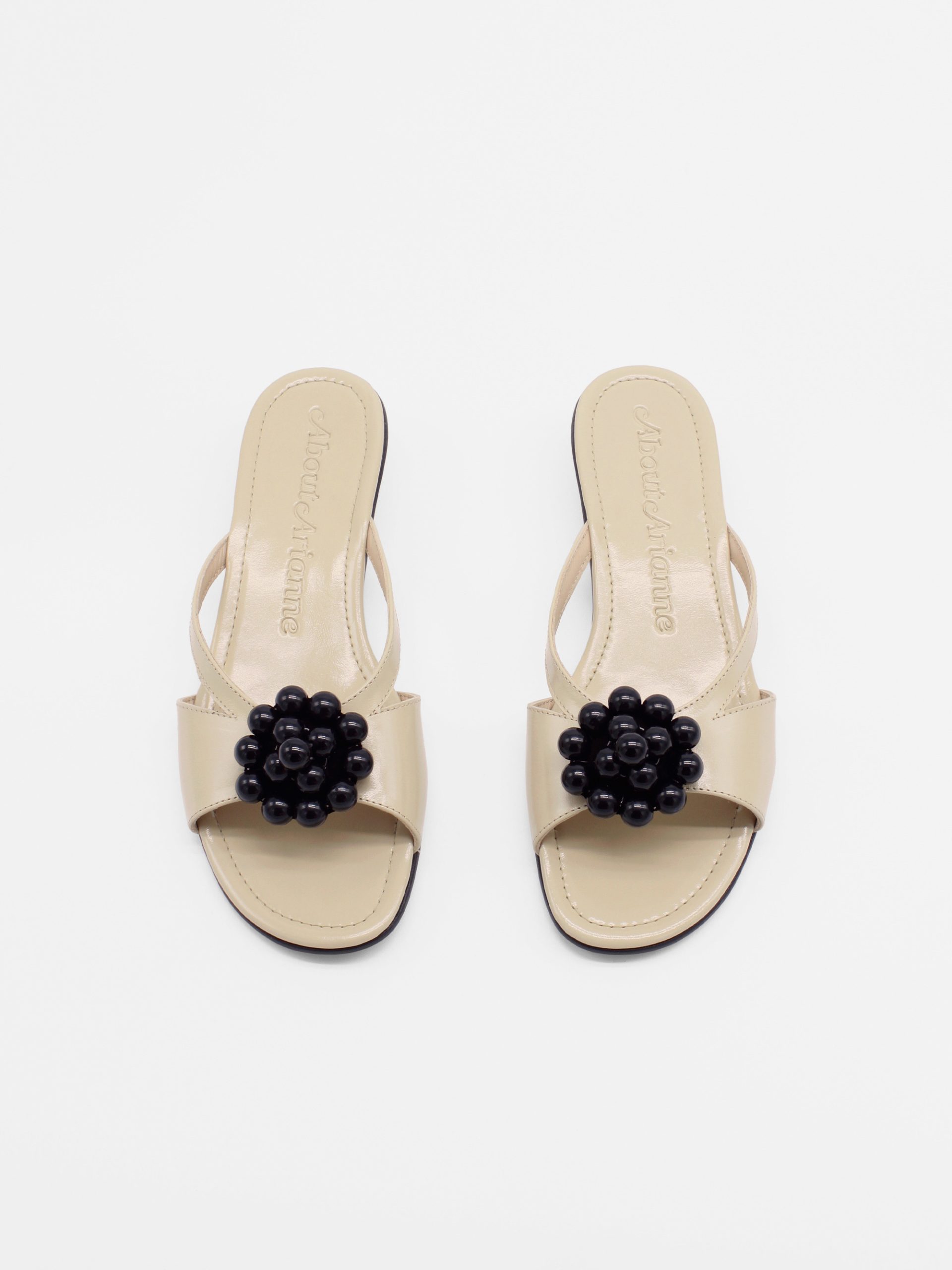 beige kitten heels with beaded ornament by about arianne