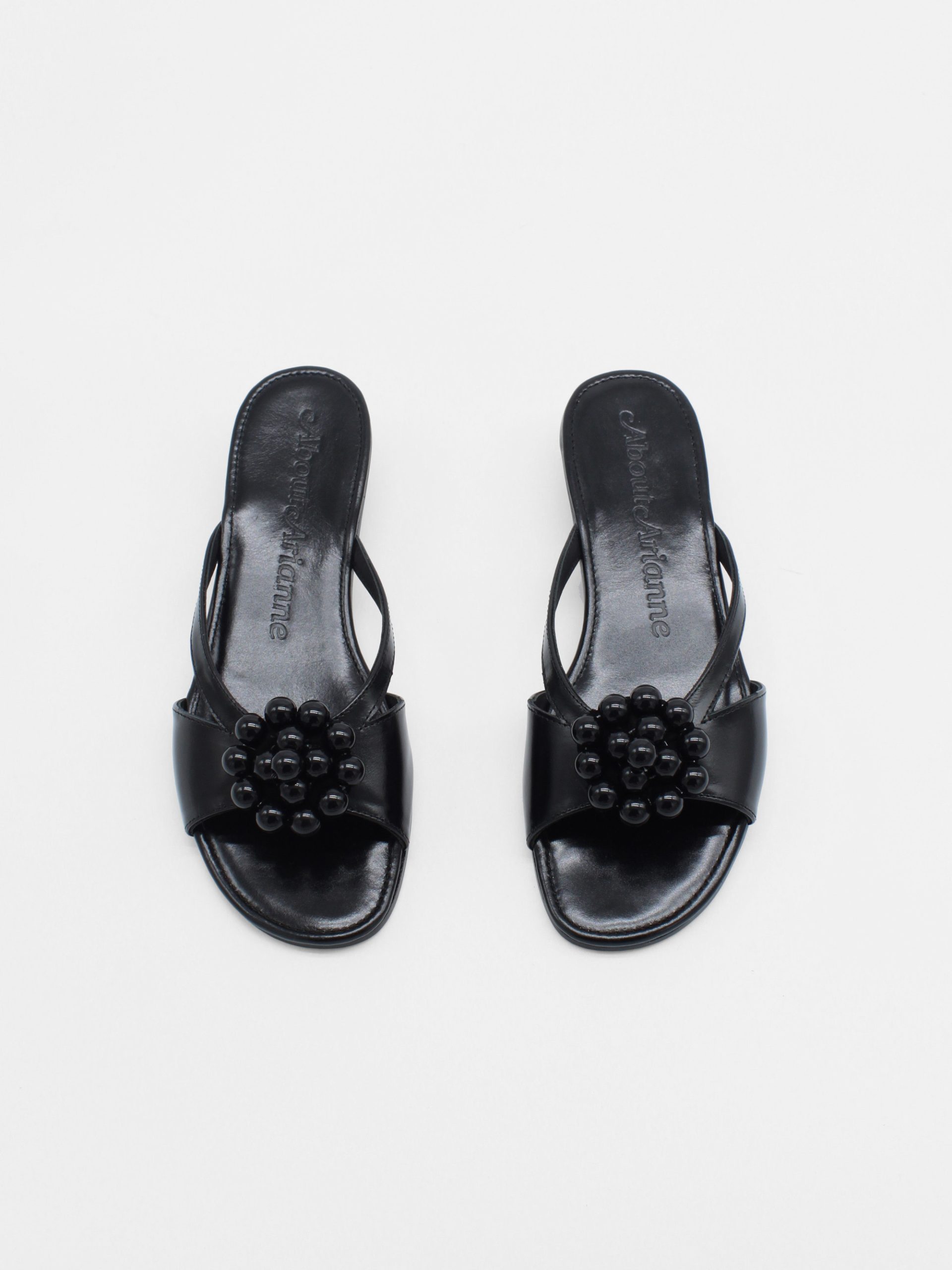 Black kitten heels with beaded ornament by about arianne