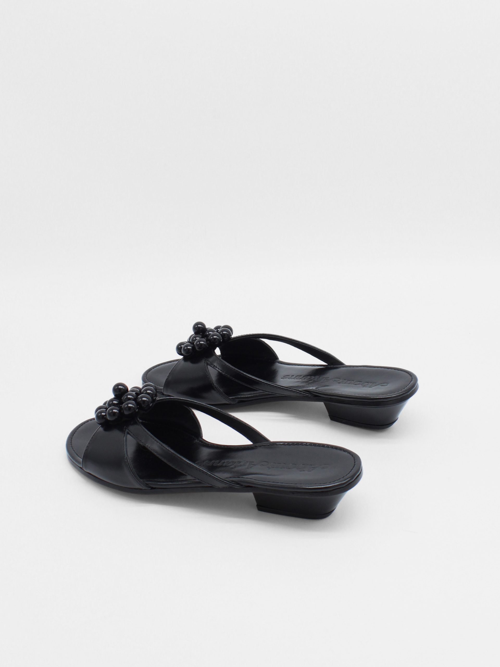 Black kitten heels with beaded ornament by about arianne