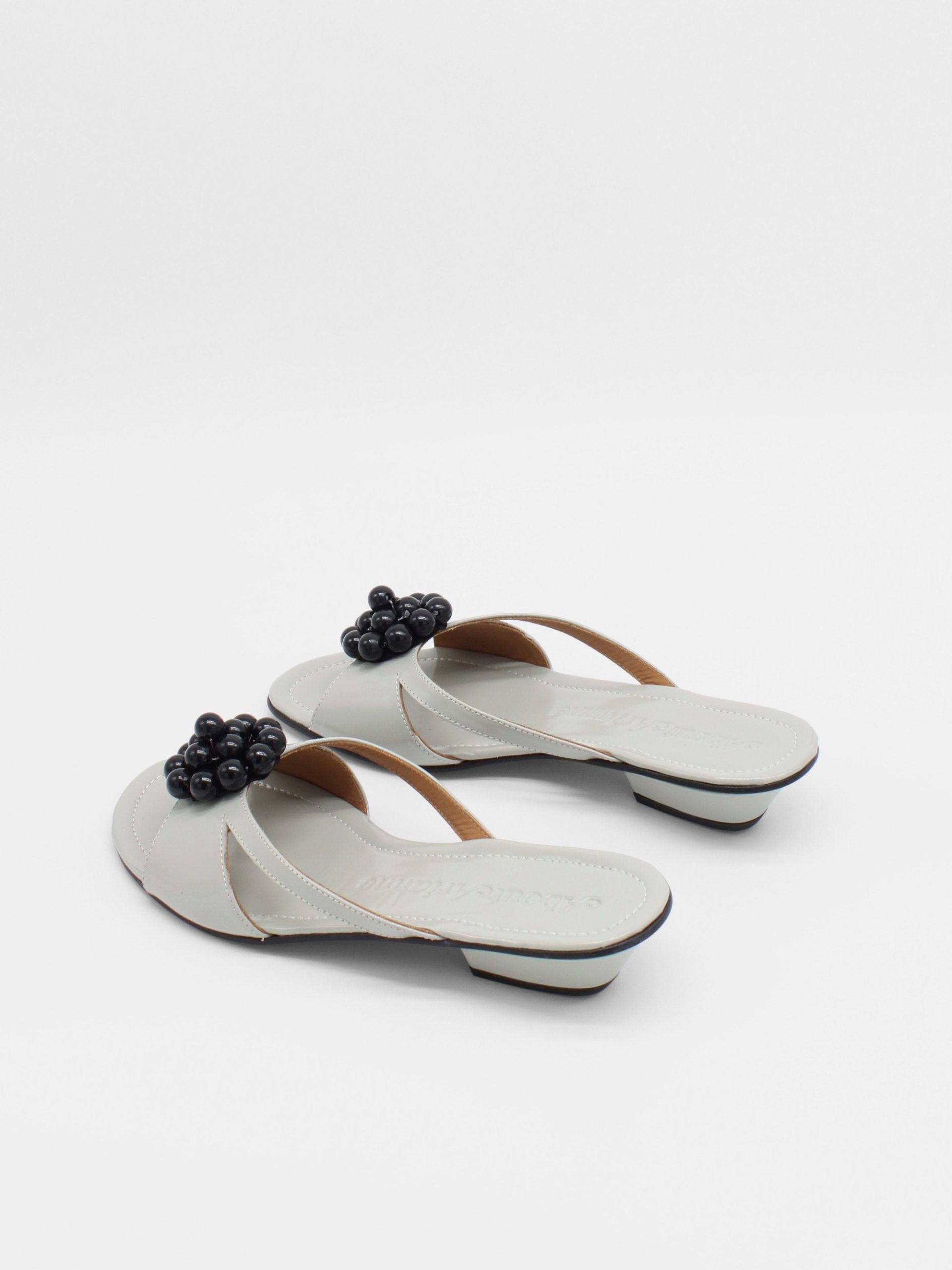 gray kitten heels with beaded ornament by about arianne