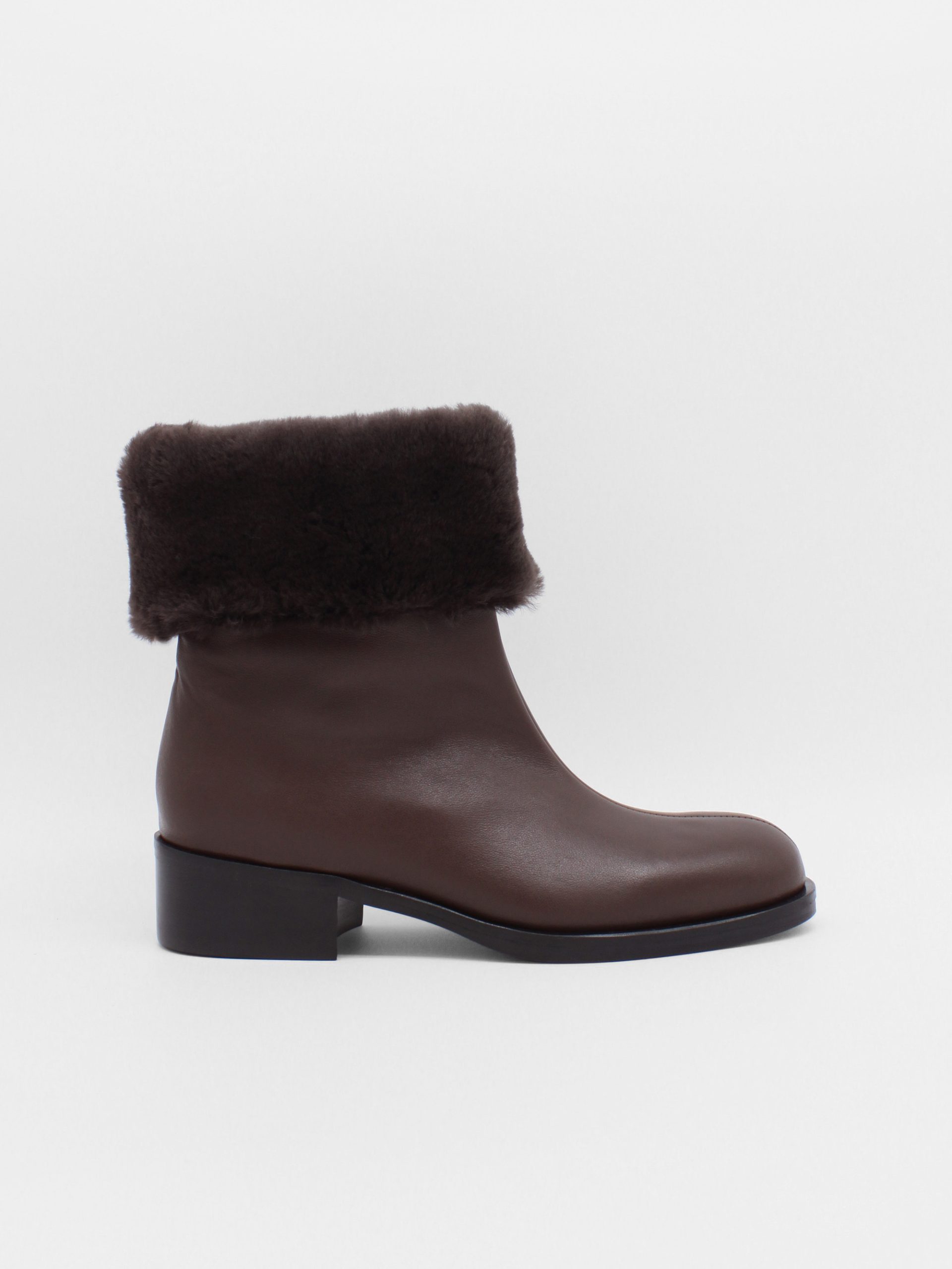 fur lined mid rise boots in brown leather