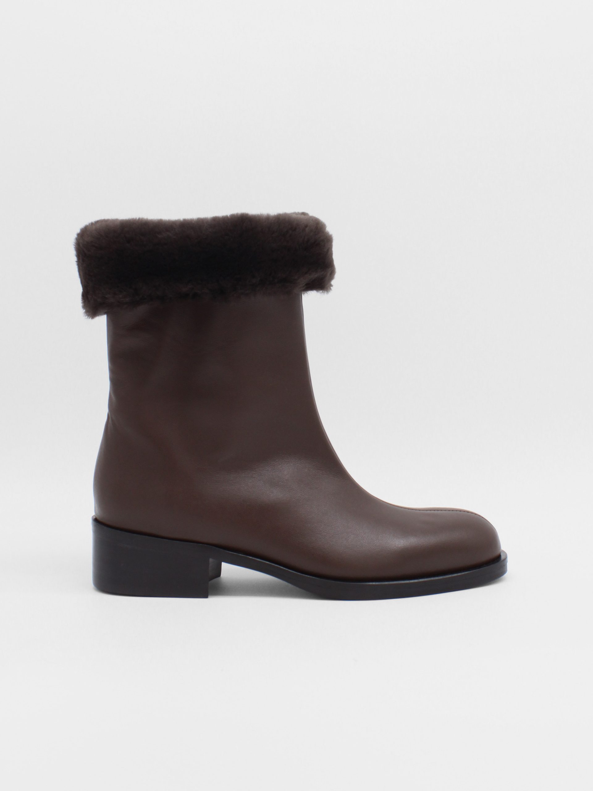 fur lined mid rise boots in brown leather