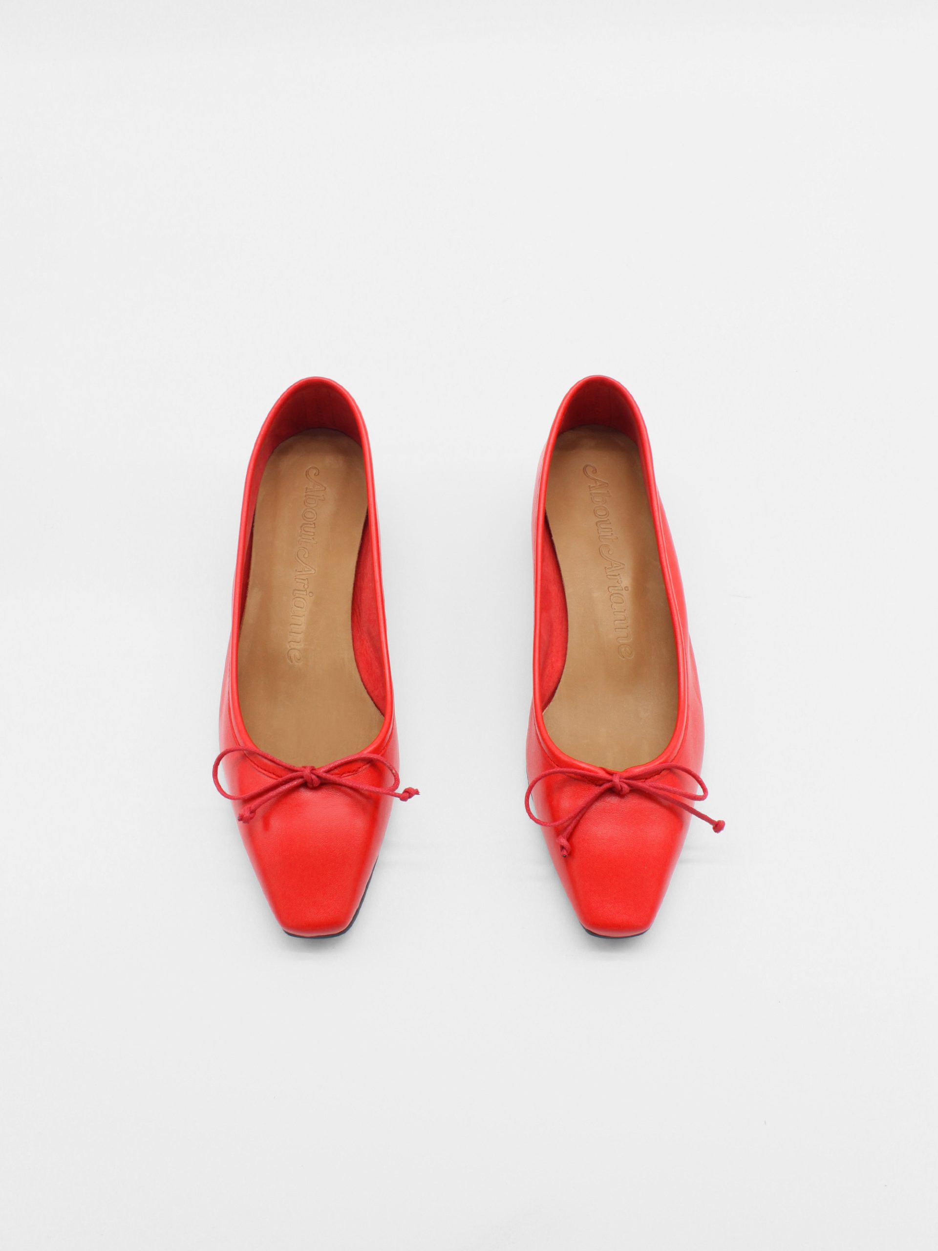 Heeled ballet flats in red by about arianne