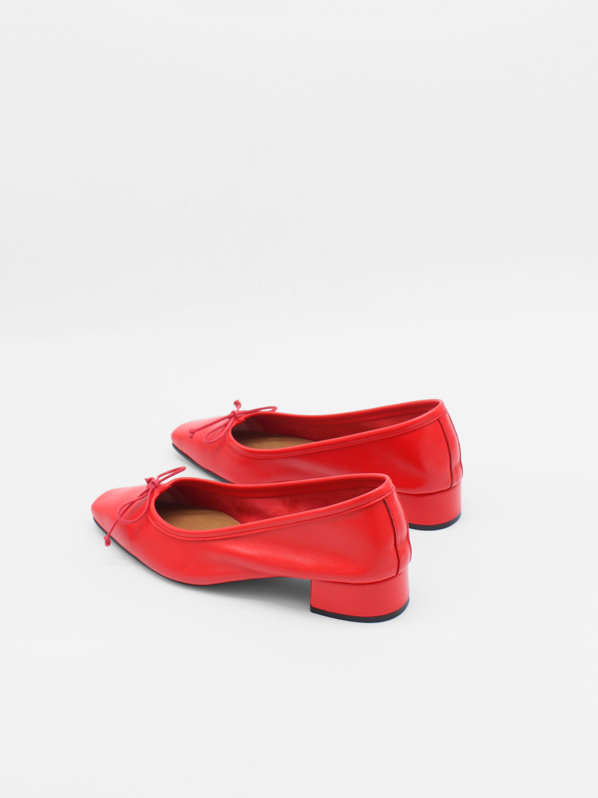 Heeled ballet flats in red by about arianne